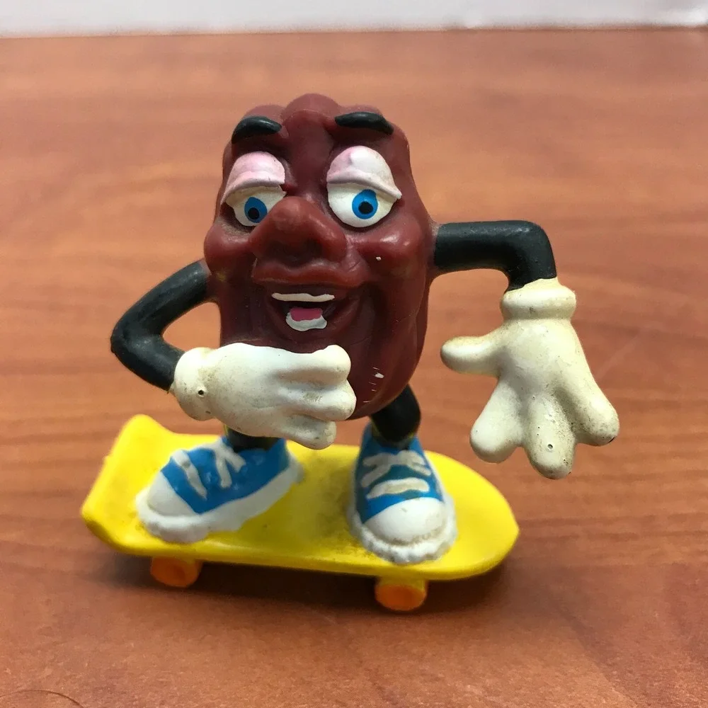 4 Vintage California Raisins figurines - Guitar - Skateboard - Surfer - Trumpet
